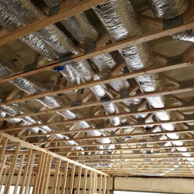 HVAC ventilation installed in new construction rafters